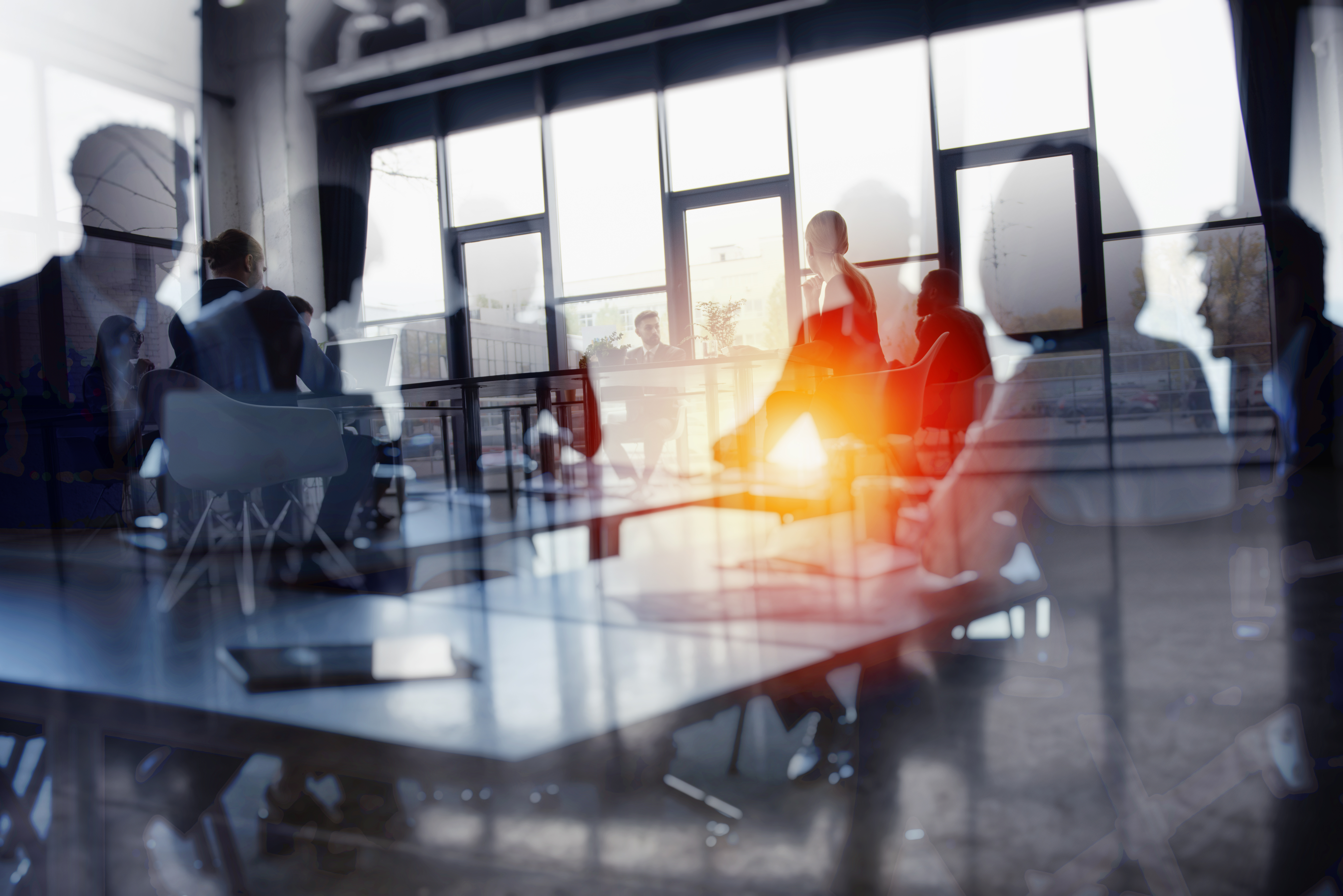 A blurred image of office working at desks
